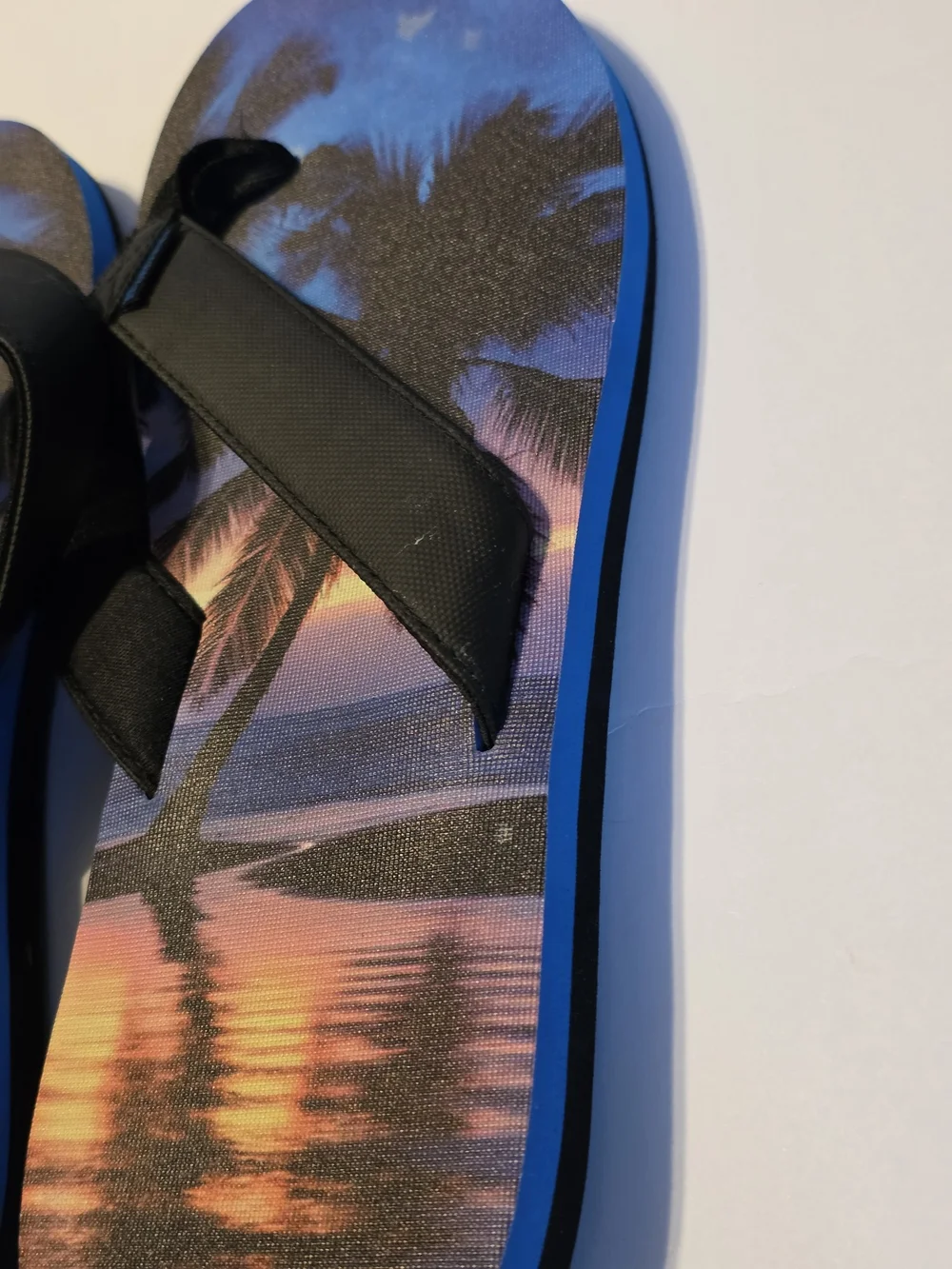 No Boundaries Men's Tropical Sunset Flip Flops - Black Straps, Blue/Purple Print
